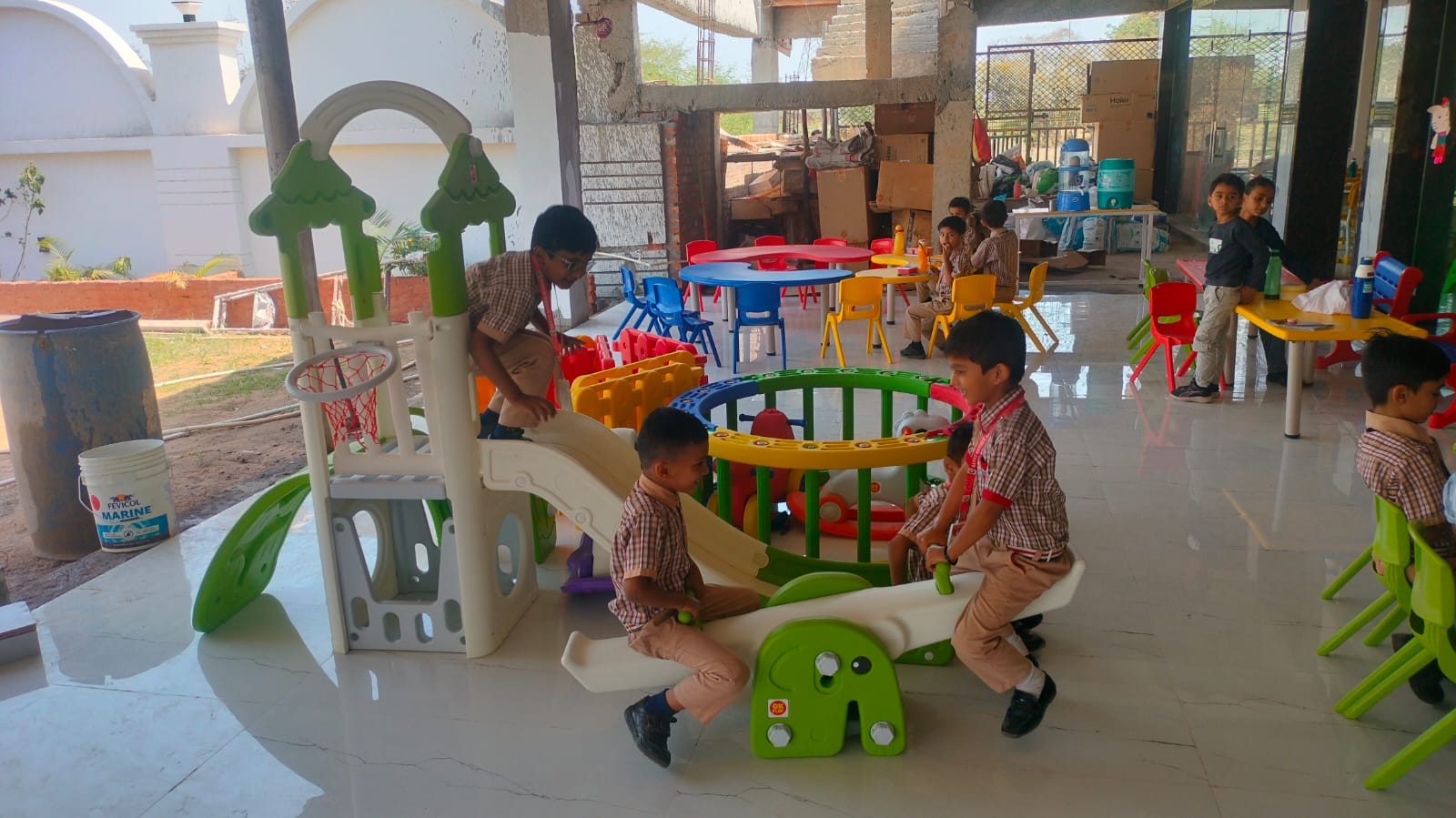 Children enjoying indoor play equipment