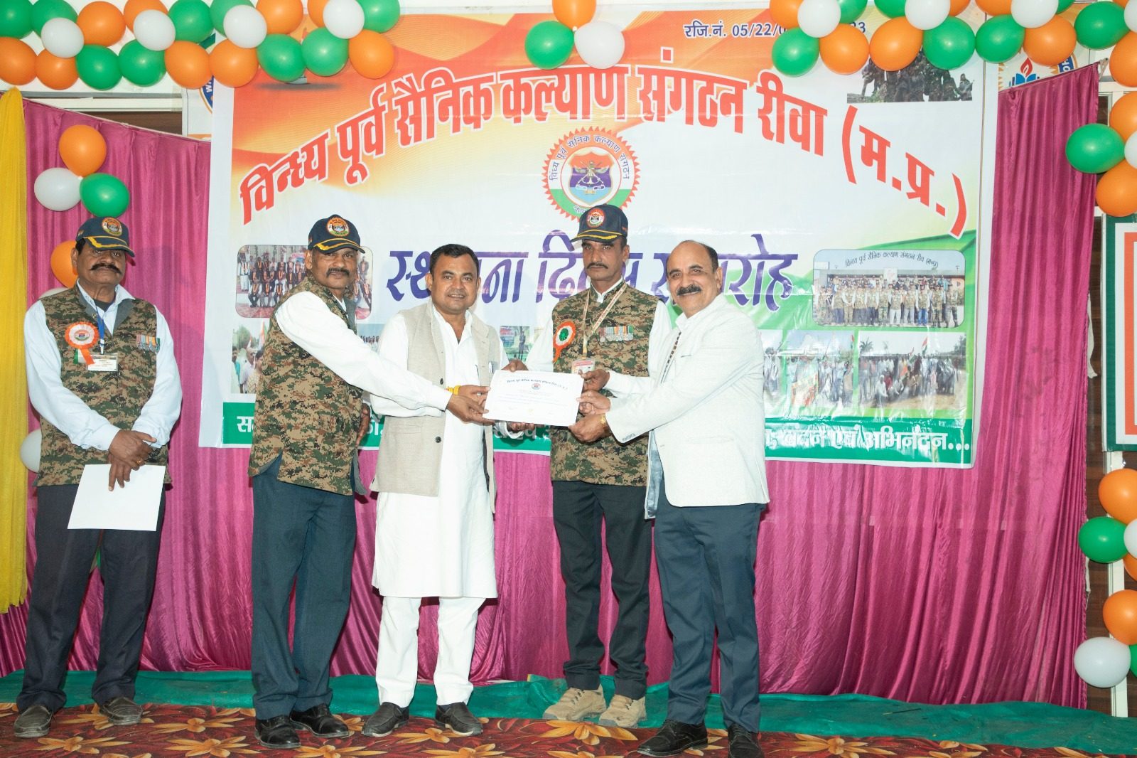Certificate being presented on stage