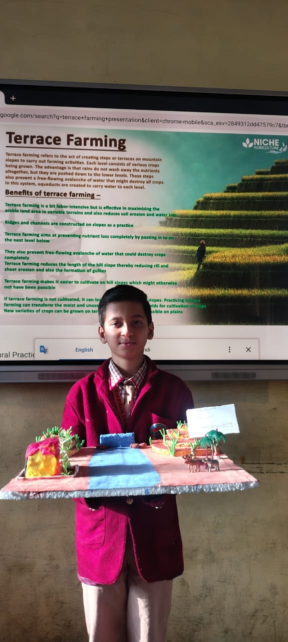 Student presenting a project with a digital classroom board
