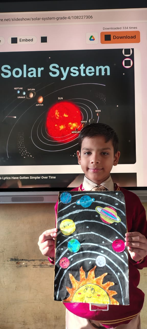 Student presenting a solar system activity on a digital board