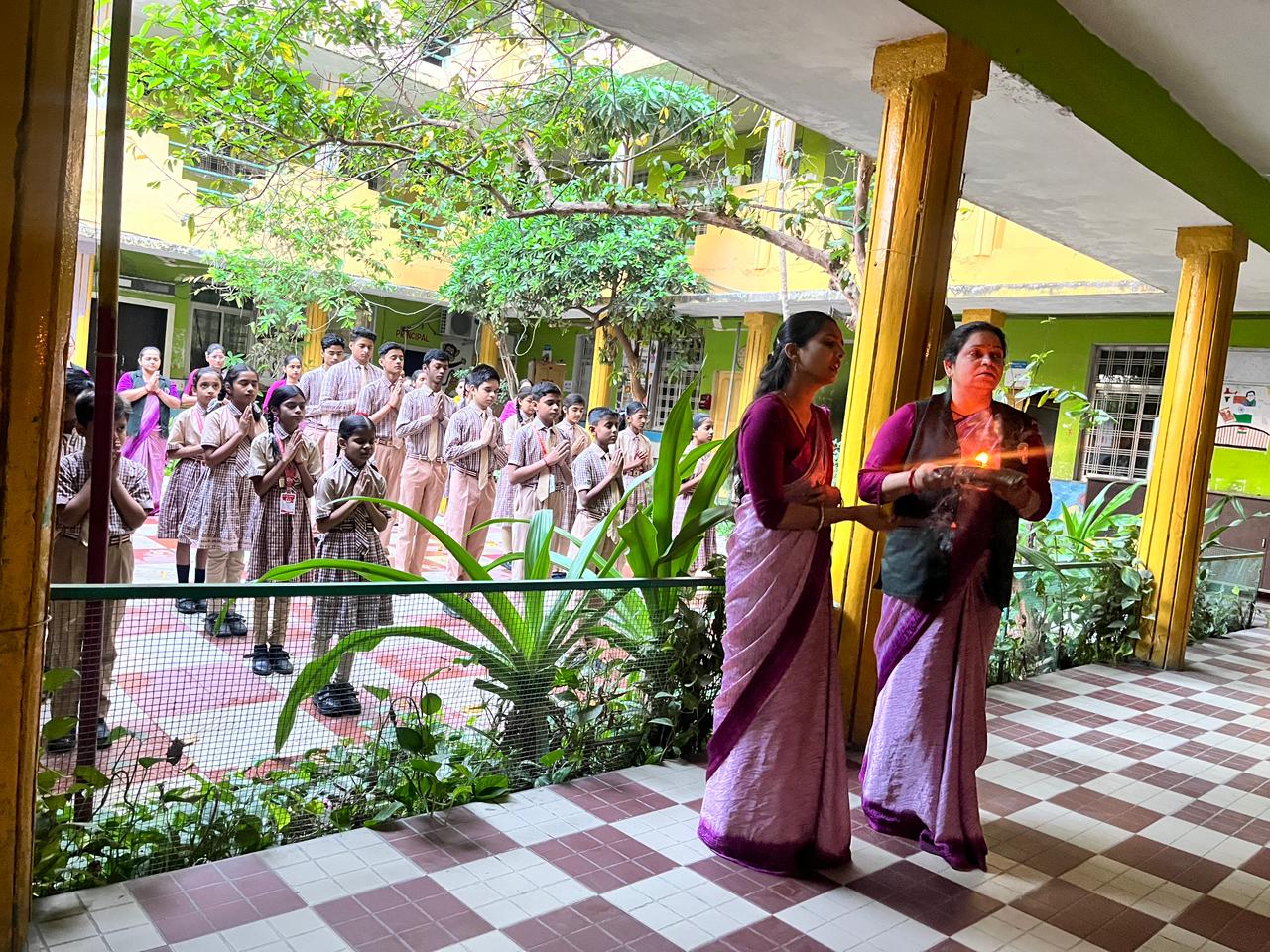 Morning assembly in the green school courtyard