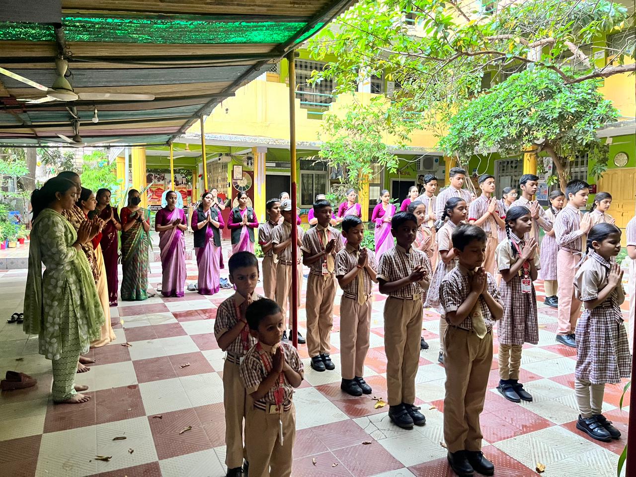 School assembly with teachers and students
